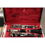 A BOOSEY & HAWKES CLARINET IN TRAVEL HARD CASE WITH A SELECTION OF CLARINET MAGAZINES