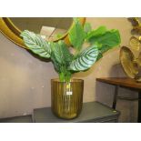 A LARGE MODERN GOLD PLANTER AND FAKE PLANT