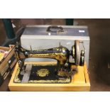 A CASED SEWING MACHINE WITH KEY INCLUDED