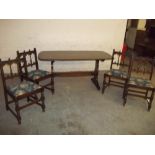 AN ERCOL DINING SET TABLE AND 4 CHAIRS