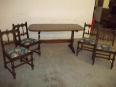 AN ERCOL DINING SET TABLE AND 4 CHAIRS