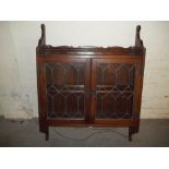 AN OAK OLD CHARM LEADED WALL DISPLAY CABINET