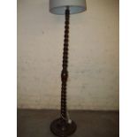 A BARLEY TWIST ANTIQUE FLOOR STANDING STANDARD LAMP