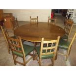 A SOLID OAK DROP LEAF DINING SET AND 8 CHAIRS