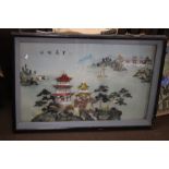 A FRAMED ORIENTAL TYPE PICTURE