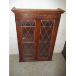 AN OAK LEADED OLD CHARM GLAZER BOOKCASE