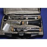 A BUFFET CLARINET IN CASE ALONG WITH 2 MUSIC STANDS