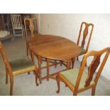 AN OAK DROP LEAF DINING SET WITH TABLE AND 4 CHAIRS