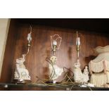 THREE TABLE LAMPS AND SHADES EACH WITH A LADY FIGURE TO THE BASE