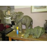 A LARGE RESIN STANDING ELEPHANT H-80 L-94 CM AND A SIMILAR ELEPHANT (2)