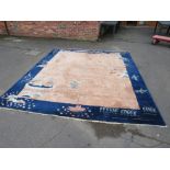 A LARGE BLUE WOOLLEN RUG X CM