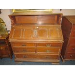 A LARGE CARVED OAK BUREAU H- 126 W-122 CM