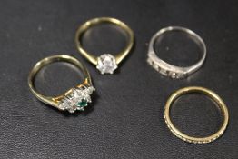 A COLLECTION OF FOUR ASSORTED DRESS RINGS TO INCLUDE A SILVER EXAMPLE