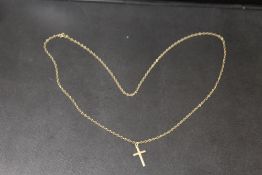 A HALLMARKED 9CT GOLD CRUCIFIX ON A CHAIN STAMPED 9K - APPROX WEIGHT 3.1 G