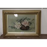 A FRAMED AND GLAZED STILL LIFE STUDY OF ROSES ON A TABLE, INDISTINCTLY SIGNED LOWER RIGHT