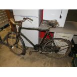 A VINTAGE RALEIGH BICYCLE WITH SPRING SEAT A/F