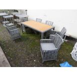 A MODERN RECTANGULAR PATIO TABLE AND SIX CHAIRS