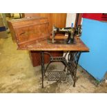 A VINTAGE TREADLE SEWING MACHINE WITH CAST BASE A/F