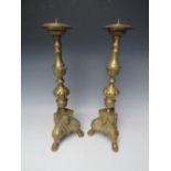 A PAIR OF DECORATIVE BRASS PRICKET CANDLESTICKS, with cherubic mask detail, H 43 cm (2)