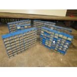 AN ASSORTMENT OF PLASTIC ORGANISER DRAWERS CONTAINING RESISTORS, CAPACITORS, I C CHIPS, SCREWS AND