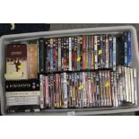 A TRAY AND A BOX OF DVDS - UNCHECKED