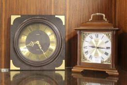 A RHYTHM HOUR STRIKE TRANSISTOR CLOCK TOGETHER WITH A METAMEC WALL MOUNTED EXAMPLE