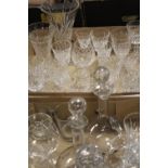 TWO TRAYS OF ASSORTED GLASSWARE TO INCLUDE DECANTERS, WINE GLASSES ETC