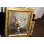 A PAIR OF PICTURES BOTH GILT FRAMED 1 OF FLOWERS SIGNED VERNON WARD 78 CM X 65 CM THE OTHER SEA