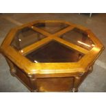 A MODERN GLASS AND WOOD COFFEE TABLE