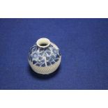 A SMALL ORIENTAL BLUE AND WHITE VASE