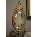A GIRONDELLE MIRROR FITTED WITH DOUBLE CANDLE HOLDER, WITH IMPRESSED REGISTRATION DIAMOND TO BACK