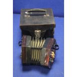 AN ANTIQUE CASED ACCORDION