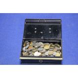 AN OLD FASHIONED SAVINGS BOX WITH KEY CONTAINING A LARGE QUANTITY OF FOREIGN COINS