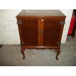 A REPRODUCTION DRINKS CABINET WITH CROSS BANDED DETAIL