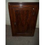 AN ANTIQUE MAHOGANY CORNER CABINET