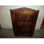 AN ANTIQUE PANELED WALL HANGING CORNER CABINET ConditonReport:THERE ARE SLIGHT SIGNS OF WOODWORM