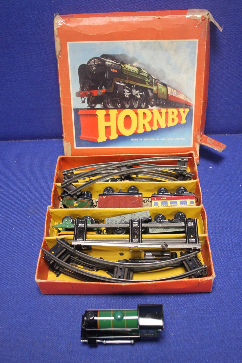 BOXED HORNBY TRAIN O GAUGE GOODS SET WITH TRACK, TENDER, CARRIAGE AND ROLLING STOCK, together with a