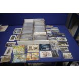 TWO TRAYS OF ASSORTED POSTCARDS IN MANY HUNDREDS, to include vintage examples from the early 1900s