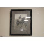 A FRAMED PHOTOGRAPH OF JOCKEY TOMMY WESTON ON HYPERION probably taken in 1933 when they won both The