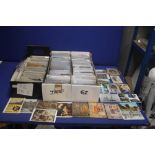 THREE TRAYS OF ASSORTED POSTCARDS IN MANY HUNDREDS, to include examples from the early 1900s