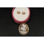 A CAMEO BROOCH STAMPED K14 TOGETHER WITH A PAIR OF CAMEO EARRINGS