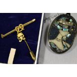A GOLD PLATED STAFFORDSHIRE KNOT BROOCH TOGETHER WITH A STICK PIN AND A NEW ZEALAND PAUA SHELL