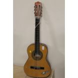 A CHILDS SIZE CHINESE ACOUSTIC GUITAR