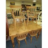 A FARMHOUSE STYLE PINE TABLE AND SIX CHAIRS