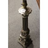 A LARGE CAST METAL LAMP BASE WITH REEDED COLUMN AND CHERUBIC DETAIL