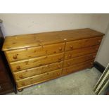 A MODERN HONEY PINE EIGHT DRAWER CHEST W-168 CM