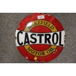 A VINTAGE STYLE ENAMEL CASTROL WAKEFIELD CIRCULAR SIGN