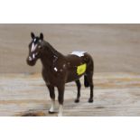 A SMALL BESWICK HORSE