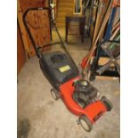 A PETROL LAWN MOWER WITH BOX