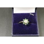AN 18CT EMERALD AND DIAMOND DRESS RING - APPROX 4G